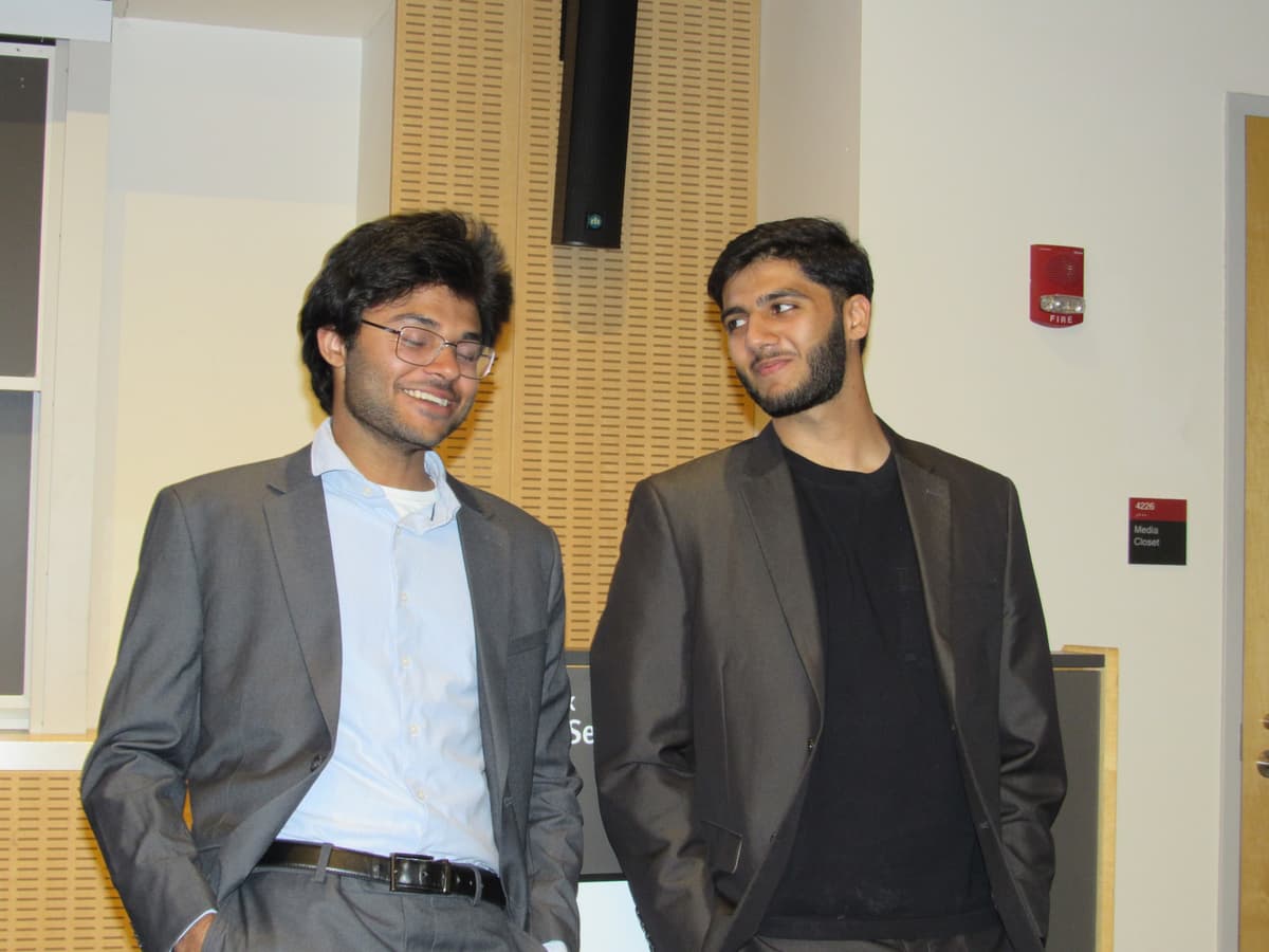 Hannan and Sameel share a moment backstage before the panel begins