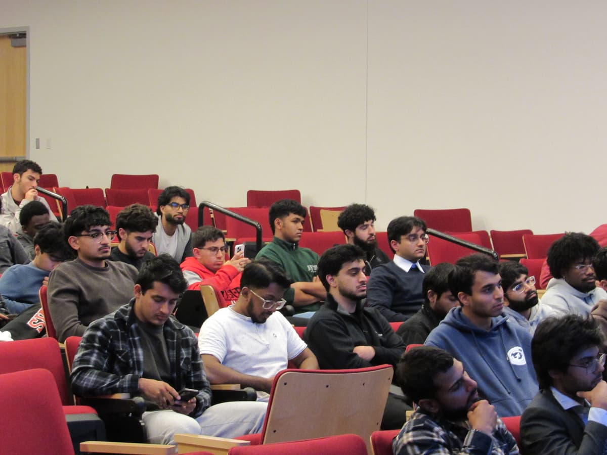 Section of the audience, students attentively following the discussion